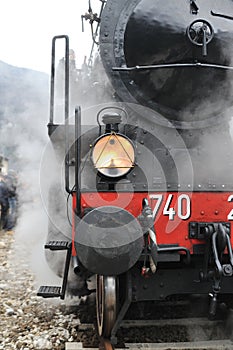 Steam train on railroad photo