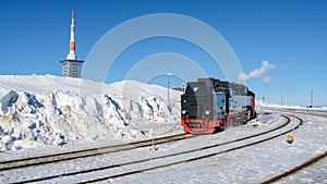 Steam train during winter in the snow in the Harz Germany Brocken Bahn