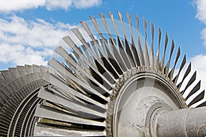 Steam turbine of nuclear power plant against sky