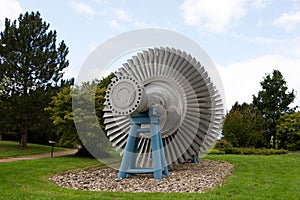 Steam turbine of nuclear power plant against a sky