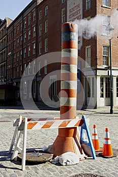 Steam venting from the street