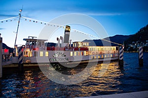 Steamboat Concordia at the Como pier by night. Lake Como, Italy photo