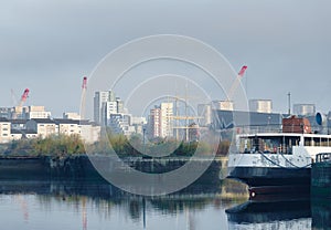 Steamboat moored on the River Clyde and construction activity in background