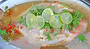 Steamed basa fish in lime dressing photo