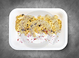 Steamed bulgur. Healthy food. Takeaway food. Top view, on a gray background