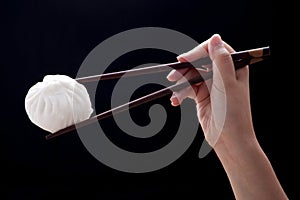 Steamed bun with chopsticks (Dim Sum)