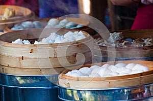 Steamed buns and meat on vendor stall, street food