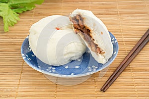 Steamed buns on plate , Baozi