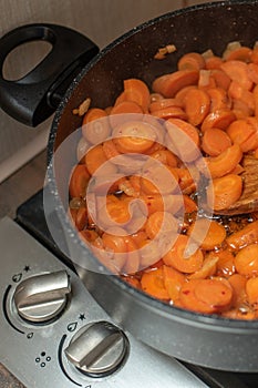 Steamed carrots in a pot