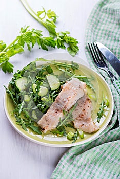 Steamed catfish filet with arugula salad