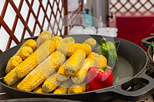 Steamed corn cobs cooking, smorgasbord