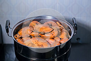 Steamed crab in pot.  live crabs in a pot. steaming shanghai hairy crabs, chinese cuisine.