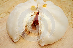 Steamed dumpling - chinese bun on brown background.