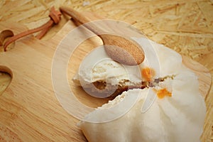 Steamed dumpling - chinese bun on brown background.