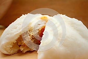 Steamed dumpling - chinese bun on brown background.