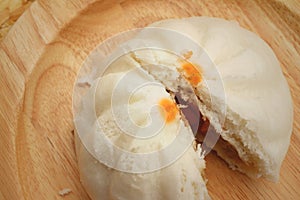 Steamed dumpling - chinese bun on brown background.