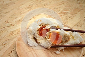 Steamed dumpling - chinese bun on brown background.