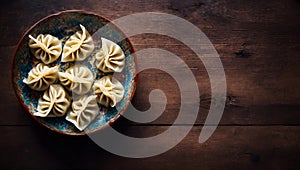 Steamed Dumplings in a Bowl on a Wooden Table Top View, Copy Space