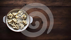 Steamed Dumplings in a Bowl on a Wooden Table Top View, Copy Space