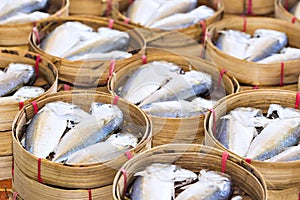 Steamed fish, Plaa Tuu (mackerel) in bamboo steamers at the seaf photo