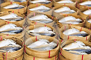 Steamed fish, Plaa Tuu (mackerel) in bamboo steamers at the seaf photo
