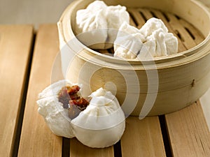 Steamed Honey BBQ Pork Bun served in dish isolated on table top view of food