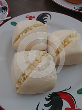 Steamed mantou bread stuffed with cheese is a typical Makassar food made in modern, Indonesia
