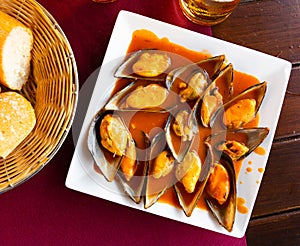 Steamed mussels with red sauce