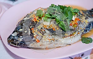 Steamed Nilotica fish,thai style steamed fish in spicy sauce.