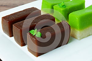 Steamed Palm Sugar Cake and Pandan Tray Cake on a plate photo