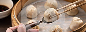 Steamed pork soup dumplings named Xiao long bao in Taiwan