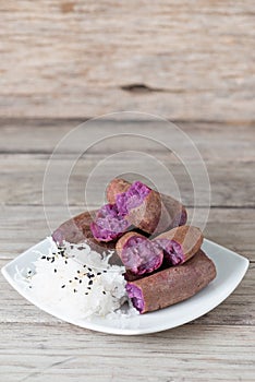 Steamed purple sweet potato in white plate