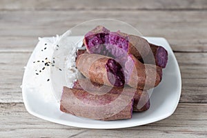 Steamed purple sweet potato in white plate