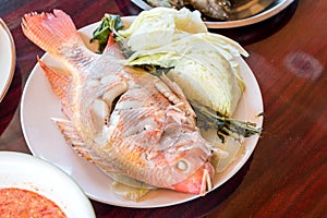 Steamed red Cichlidae or science name Oreochromis niloticus fish and cabbage favorite delicious food of Thailand. Healthy protein