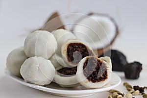 Steamed rice dumpling with a filling of palm jaggery and freshly grated coconut. Popular food of kerala commonly called Kozhikatta