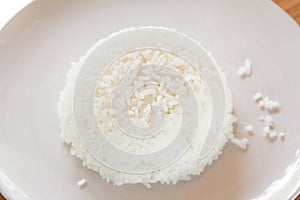 Steamed rice on white plate. photo