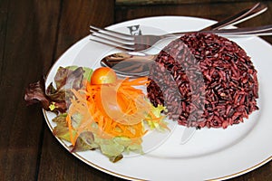 Steamed riceberry rice on a plate