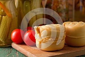 Steamed rolled cheese on a cutting board