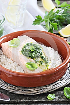 Steamed salmon with pesto and rice garnish