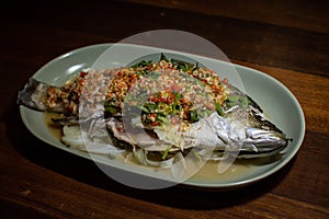 Steamed sea bass fish with lime and chili spicy soup