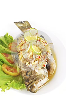 steamed sea bass with red chili / ingredient include garlic,ginger and light soy sauce.