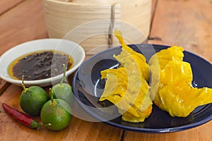 Steamed Shark fin dumplings served with chili garlic oil and calamansi