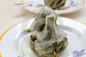 Steamed whole artichokes photo