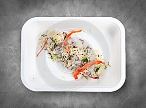 Steamed wild rice. Healthy food. Takeaway food. Top view, on a gray background