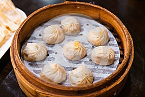 Steamed Xiao Long Bao Soup Dumplings in The Bamboo Basket. Served in Restaurant in Taipei, Taiwan