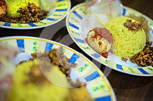 Traditional breakfast dish called `Nasi KUning` or yellow rice