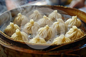 Steaming basket of Xiaolongbao, Chinese soup dumplings, in a traditional bamboo steamer