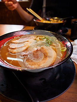 Steaming bowl of miso chashu ramen, vertical, Osaka, Japan