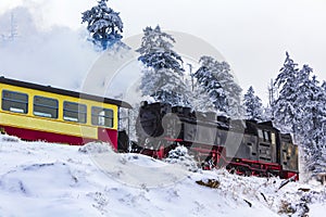 Steaming Brocken Railway locomotive in winter landscape Brocken Harz Germany