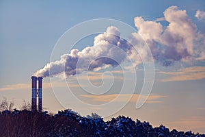 Steaming chimney`s on a background